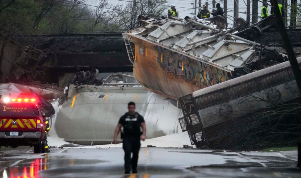 A broken section of track caused a train derailment in Indianapolis, sending five freight cars off a Southeastern Avenue overpass and spilling cornstarch onto the road during routine operations
