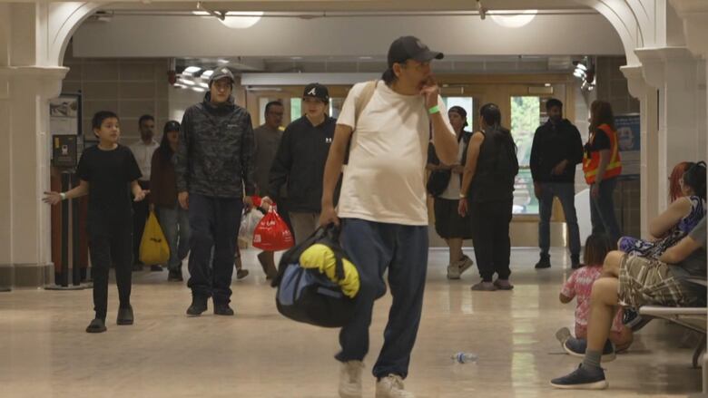 More than 120 Pukatawagan residents completed a 16-hour journey by train to Winnipeg during a large-scale evacuation caused by a fast-moving wildfire in northern Manitoba