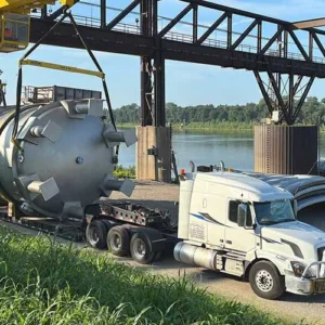 Indiana River & Rail Terminals completed a complex barge-to-truck transload for two 51-ton tanks bound for a pharmaceutical site in central Indiana.