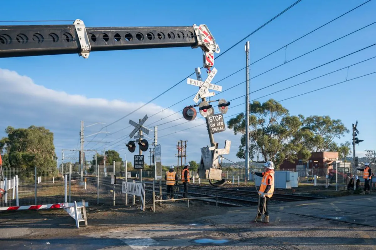 Railway crossing signage removal in Victoria Workers removing railway crossing signage in Victoria