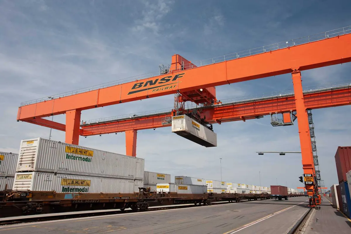 BNSF intermodal crane handling containers at a rail facility