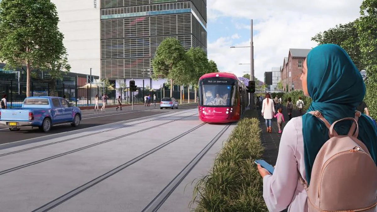 Official safety image showing a Parramatta Light Rail vehicle near pedestrians and road traffic