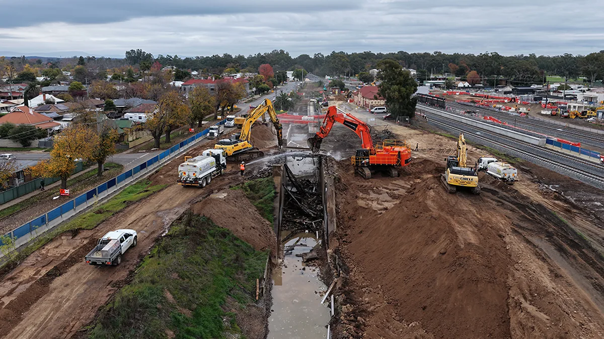 Benalla Station bridge demolition Excavators demolishing the old Benalla Station access road and bridge