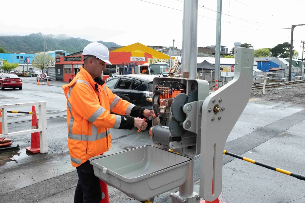 KiwiRail worker at Hutt Valley Line equipment KiwiRail worker at railway crossing equipment on the Hutt Valley Line
