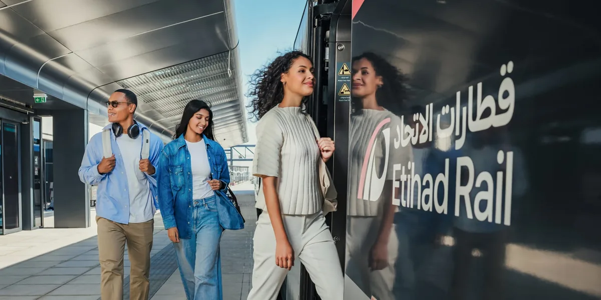 Etihad Rail passengers boarding a train Passengers boarding an Etihad Rail train
