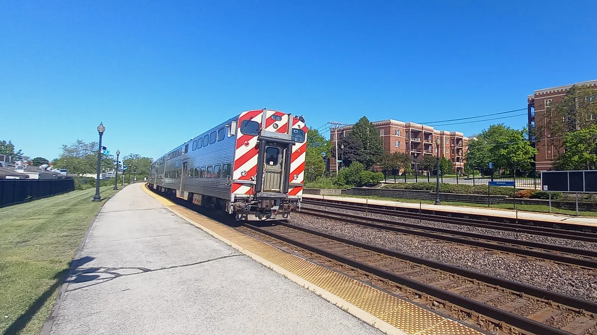 Metra train at Wheaton station Metra train with Nippon Sharyo bi-level railcars at Wheaton station