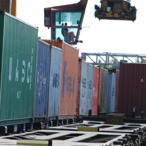 Rail freight containers being handled at an intermodal terminal