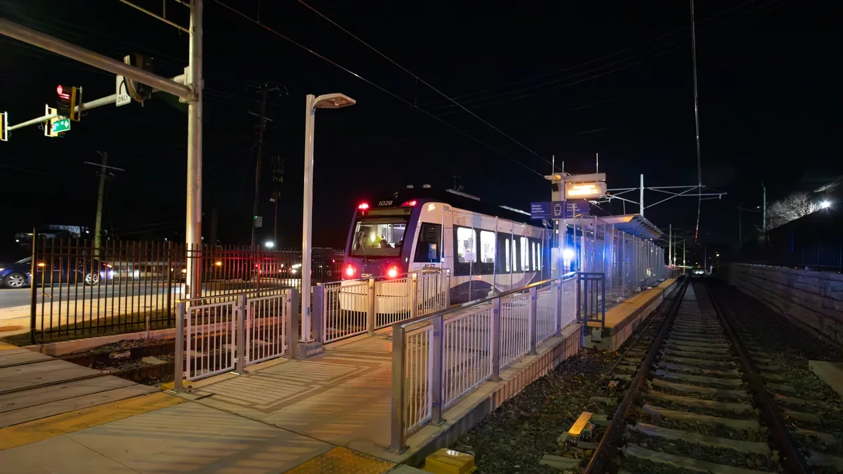 Purple Line light rail vehicle undergoing live wire testing at night Purple Line light rail vehicle undergoing live wire testing at night