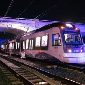 Purple Line light rail vehicle testing beneath the Baltimore-Washington Parkway