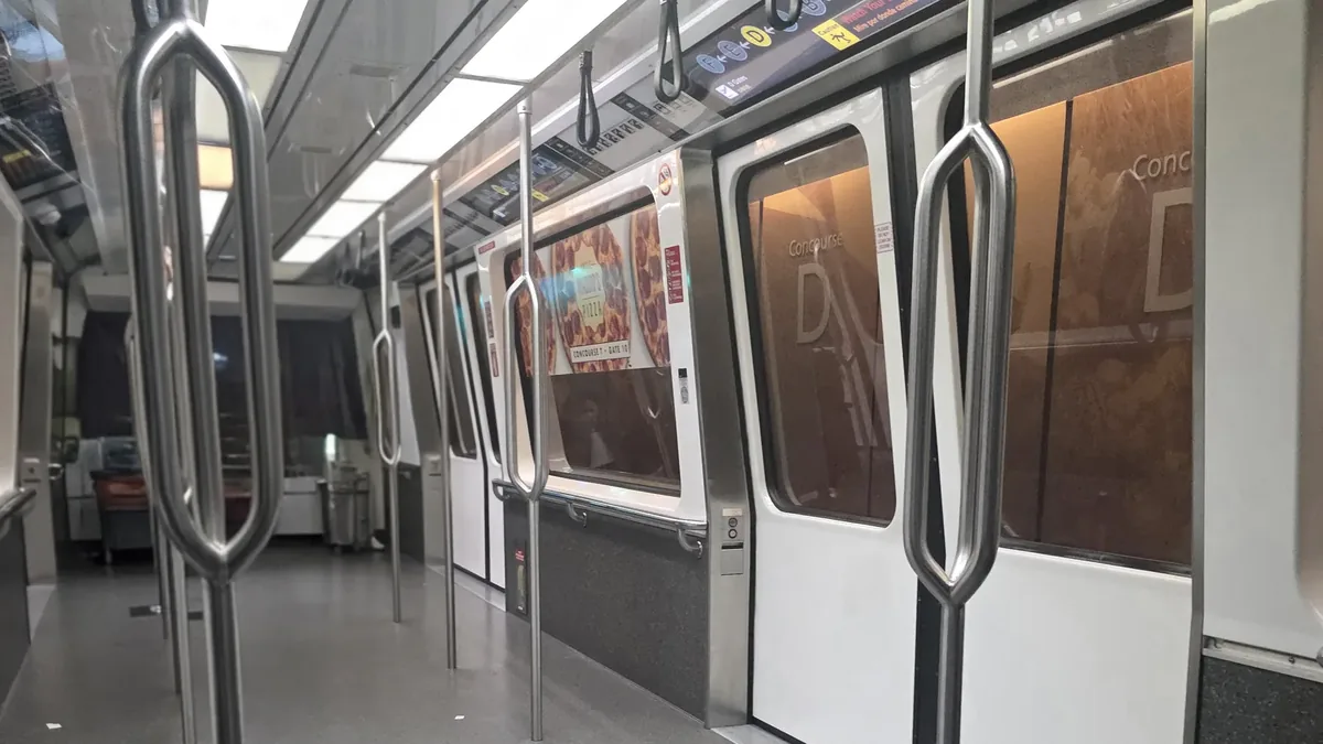 Interior of an Atlanta Plane Train car with doors, handrails and route displays Interior of an Atlanta Plane Train car with doors, handrails and route displays
