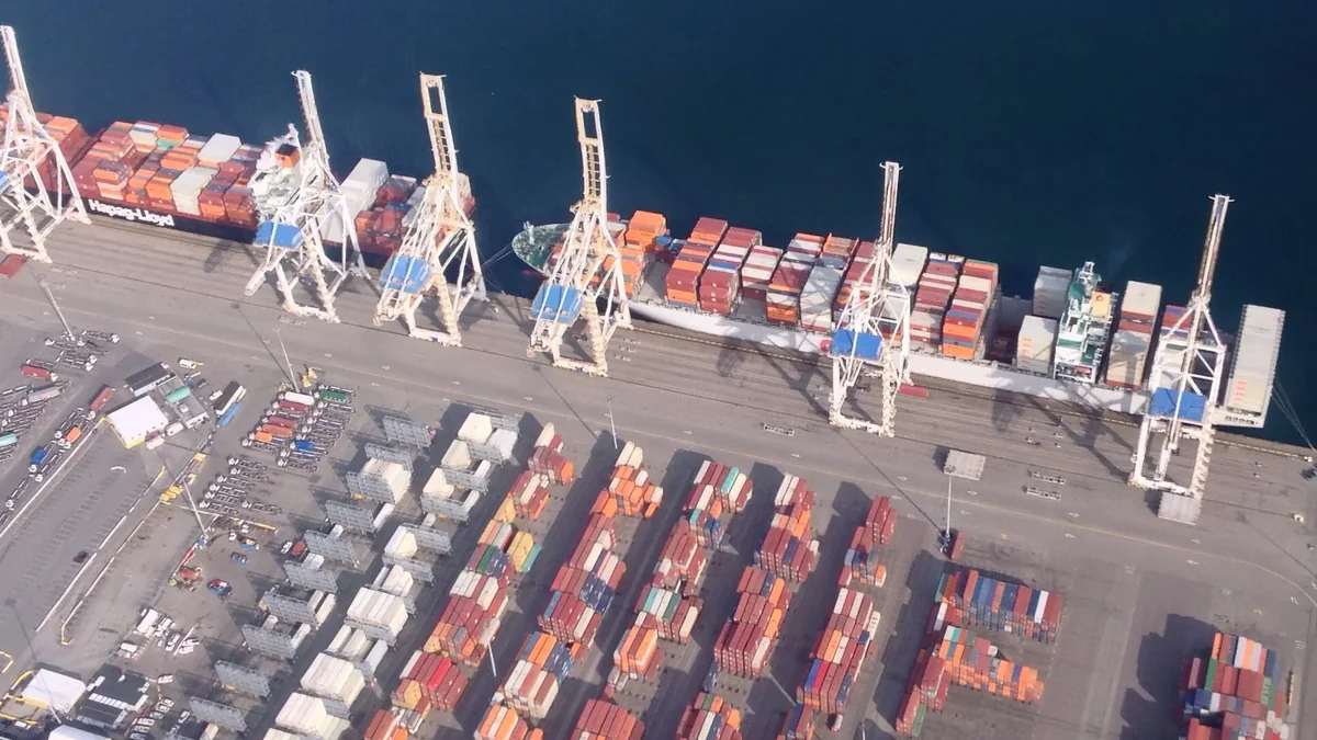 Aerial view of container ships, cranes and stacked containers at Roberts Bank Aerial view of container ships, cranes and stacked containers at Roberts Bank