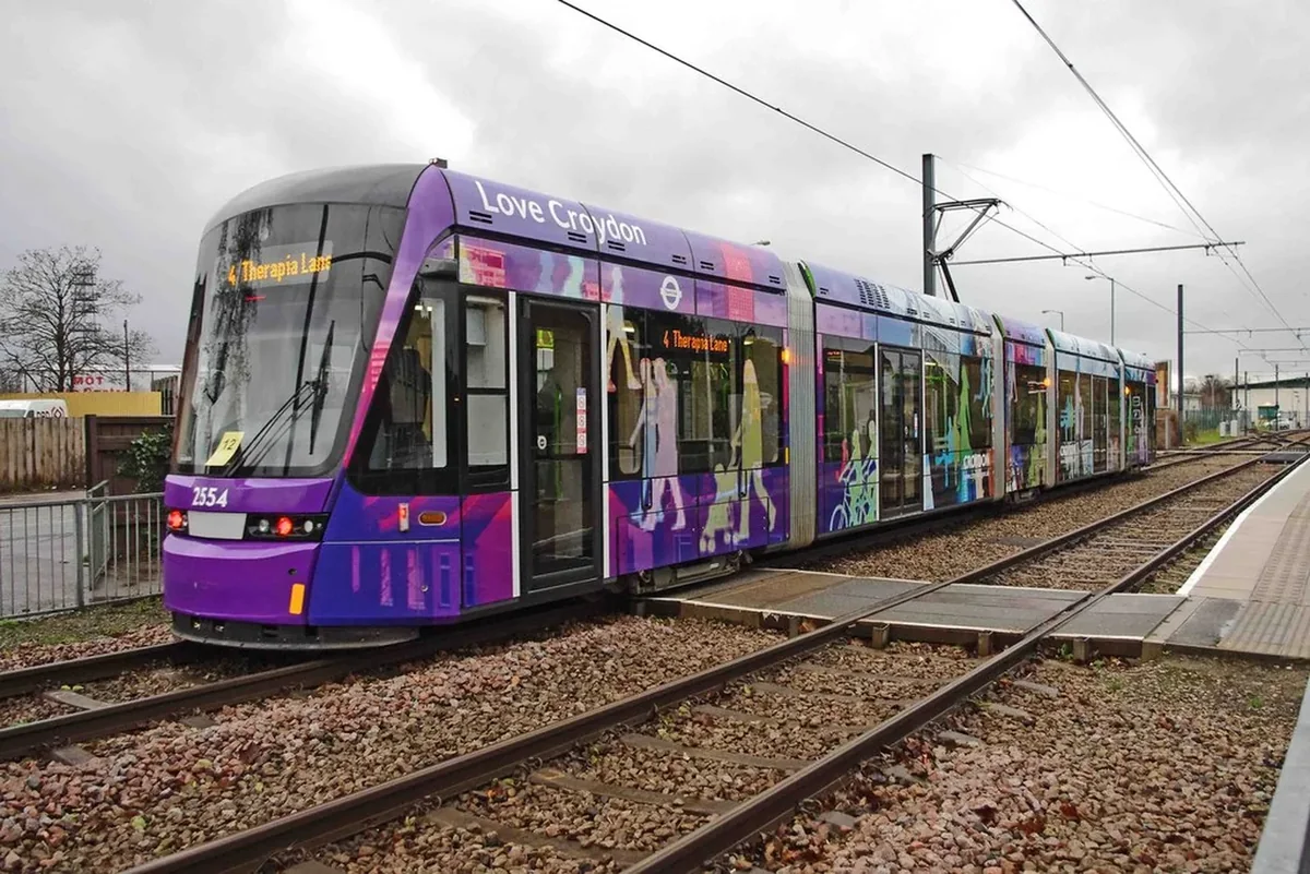 Purple London Tramlink tram 2554 entering Therapia Lane stop in Croydon Purple London Tramlink tram 2554 entering Therapia Lane stop in Croydon