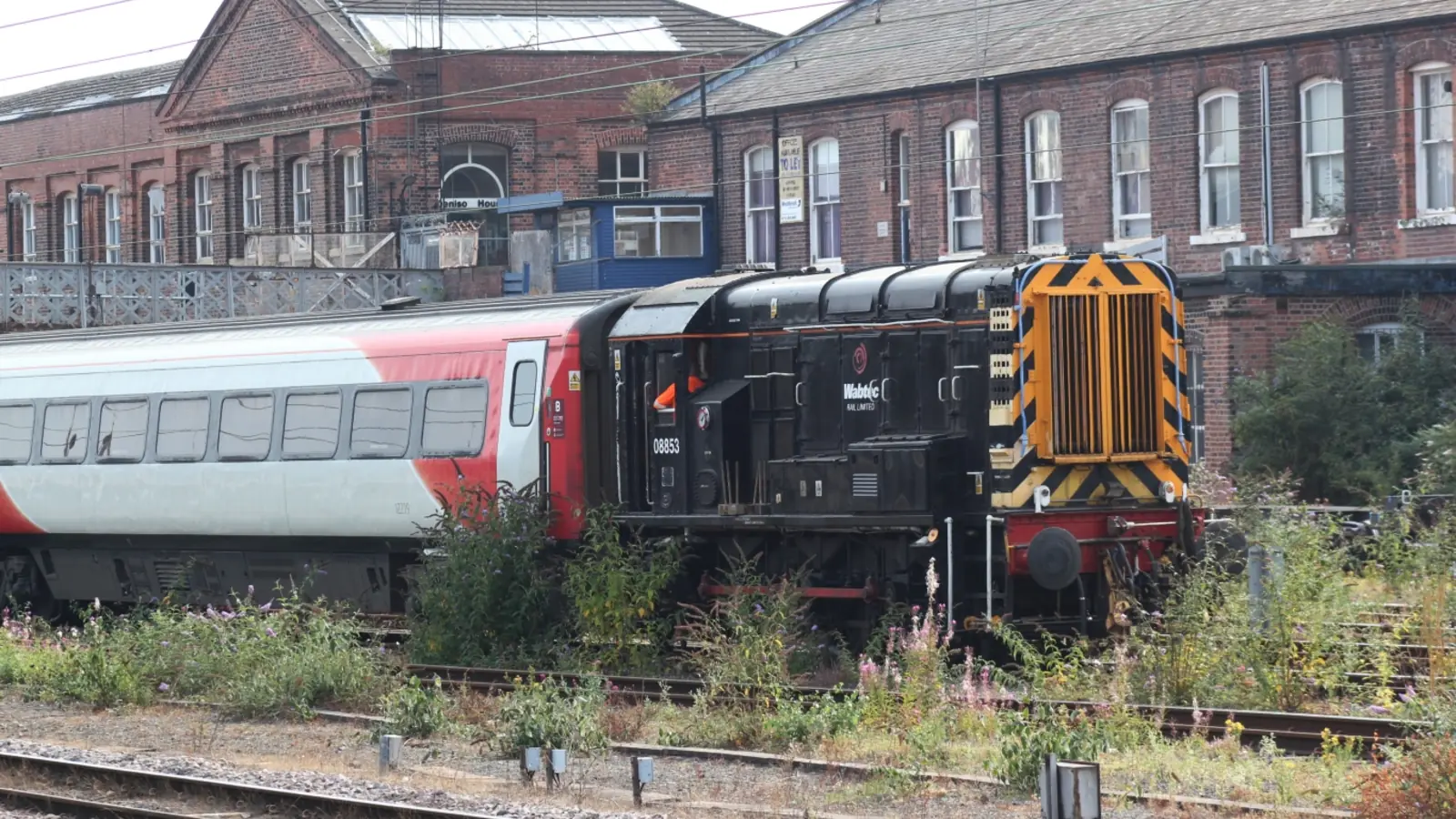 Wabtec Rail shunting locomotive with passenger coaches at Doncaster Works Wabtec Rail shunting locomotive with passenger coaches at Doncaster Works