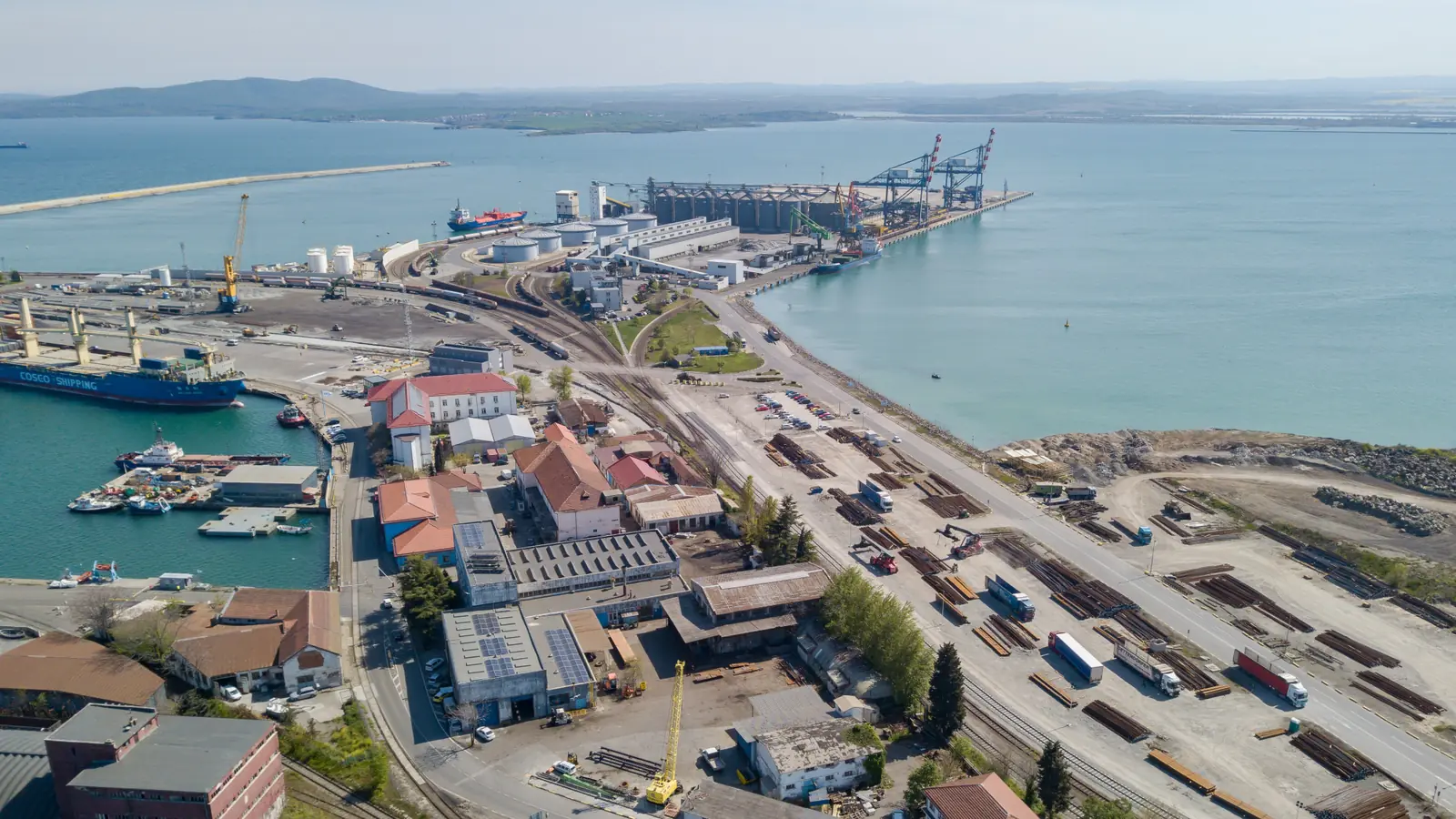 Aerial view of a Bulgarian port with railway sidings, roads and cargo-handling facilities Aerial view of a Bulgarian port with railway sidings, roads and cargo-handling facilities