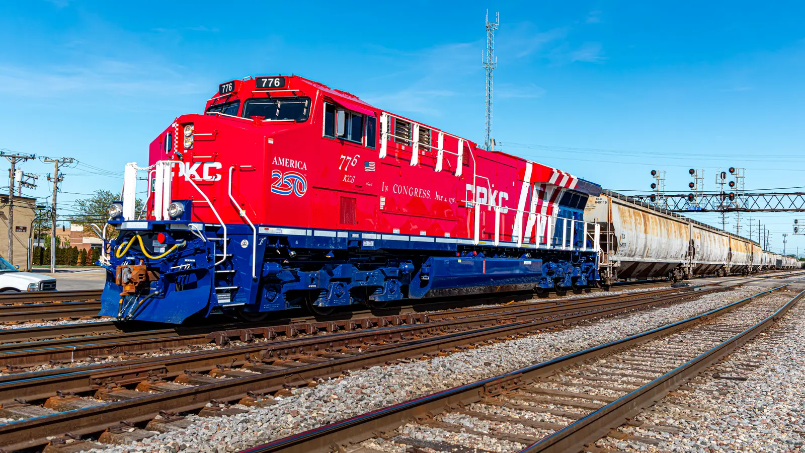CPKC No. 1776 in red, white and blue America 250 livery leading freight cars in Franklin Park, Illinois. CPKC No. 1776 in red, white and blue America 250 livery leading freight cars in Franklin Park, Illinois.