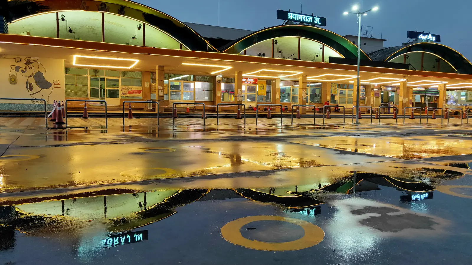 Illuminated exterior of Prayagraj Junction railway station after rain Illuminated exterior of Prayagraj Junction railway station after rain