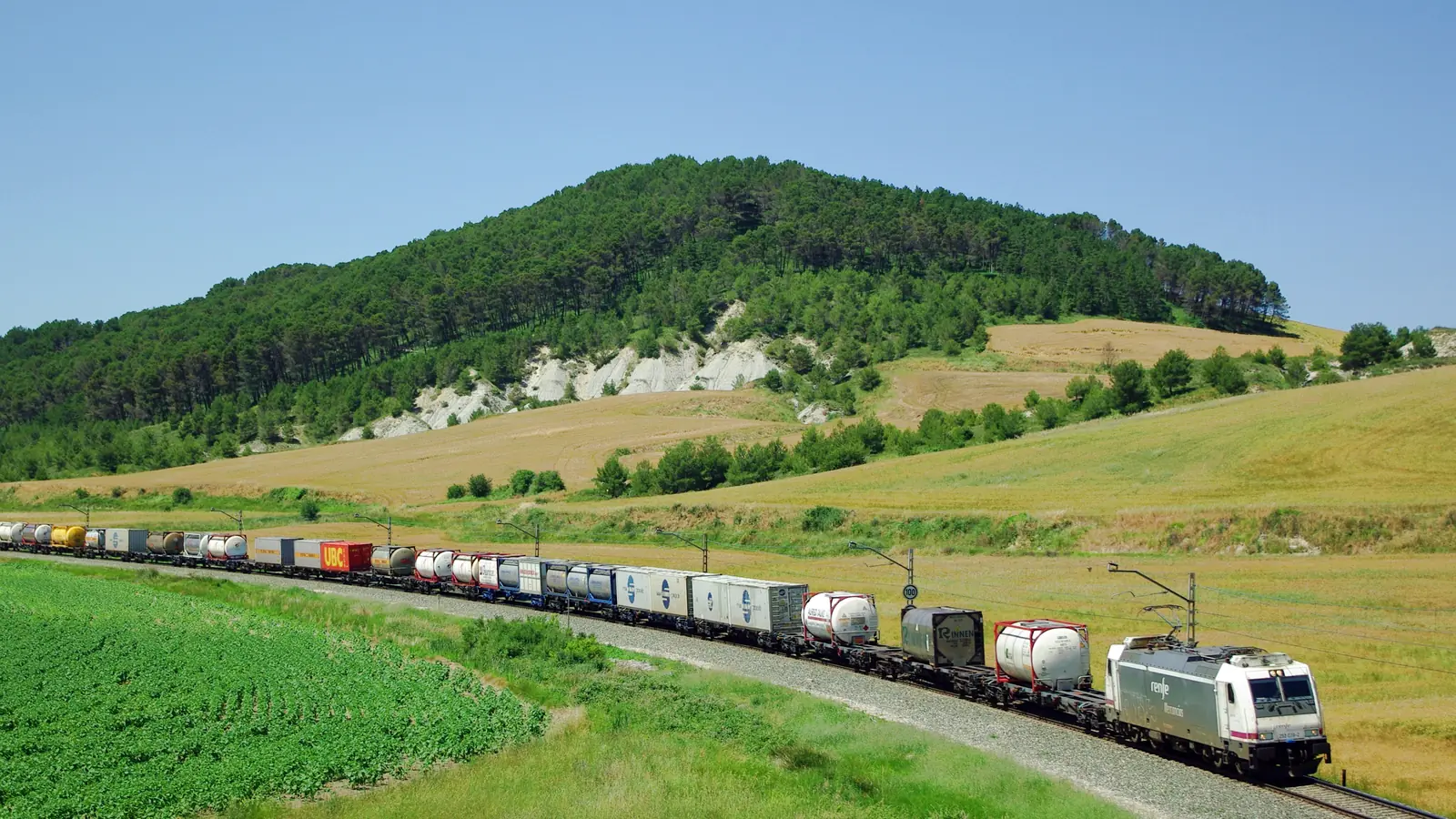 Intermodal freight train carrying containers near Noáin in Navarra