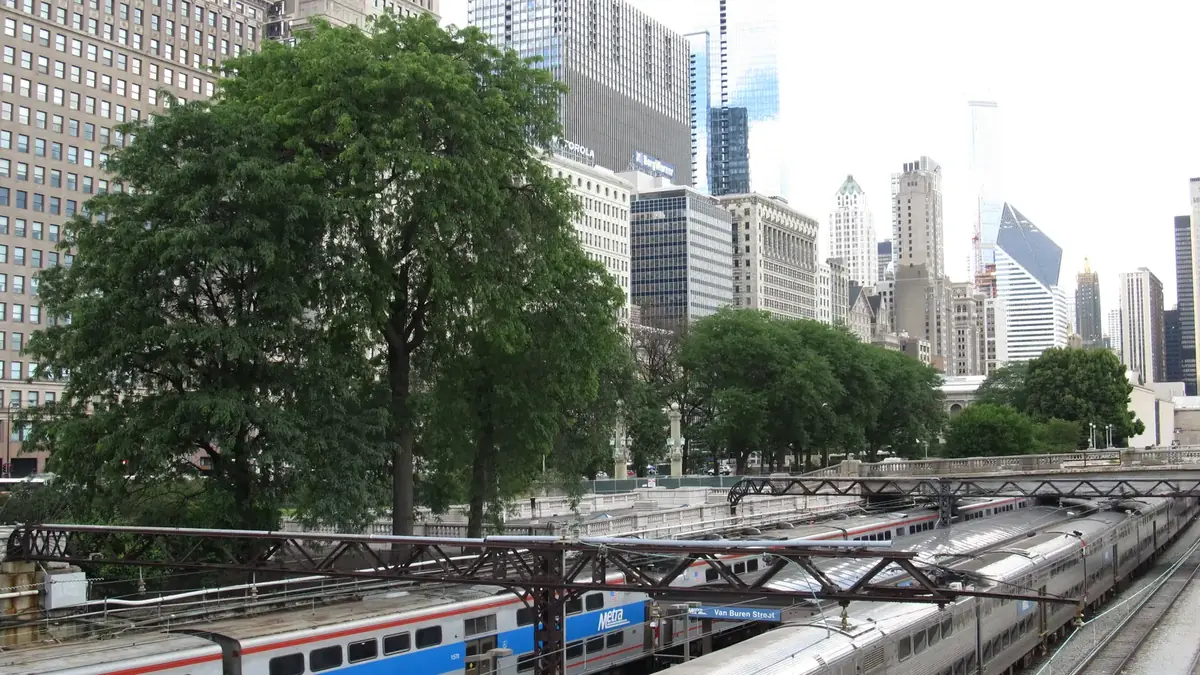 Metra Electric trains beneath overhead wires in downtown Chicago