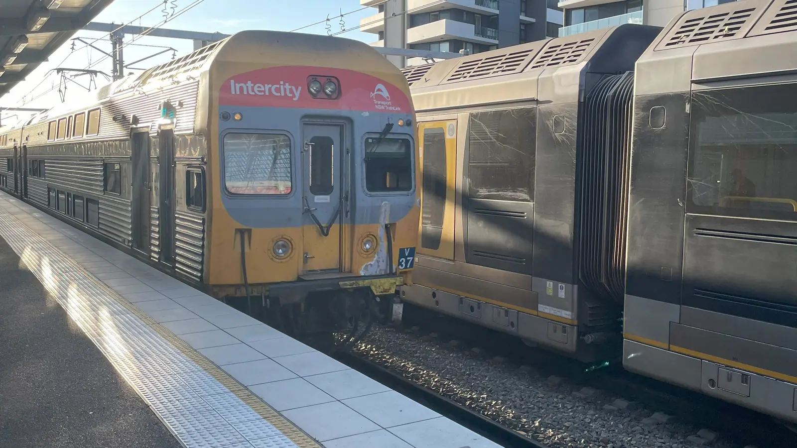 Existing NSW TrainLink intercity train beside another passenger train at Newcastle Interchange, shown as illustrative route context Existing NSW TrainLink intercity train beside another passenger train at Newcastle Interchange, shown as illustrative route context