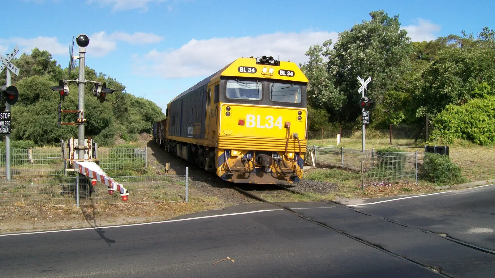 Australian freight train crossing Hillcrest Road at Frankston in Victoria Australian freight train crossing Hillcrest Road at Frankston in Victoria