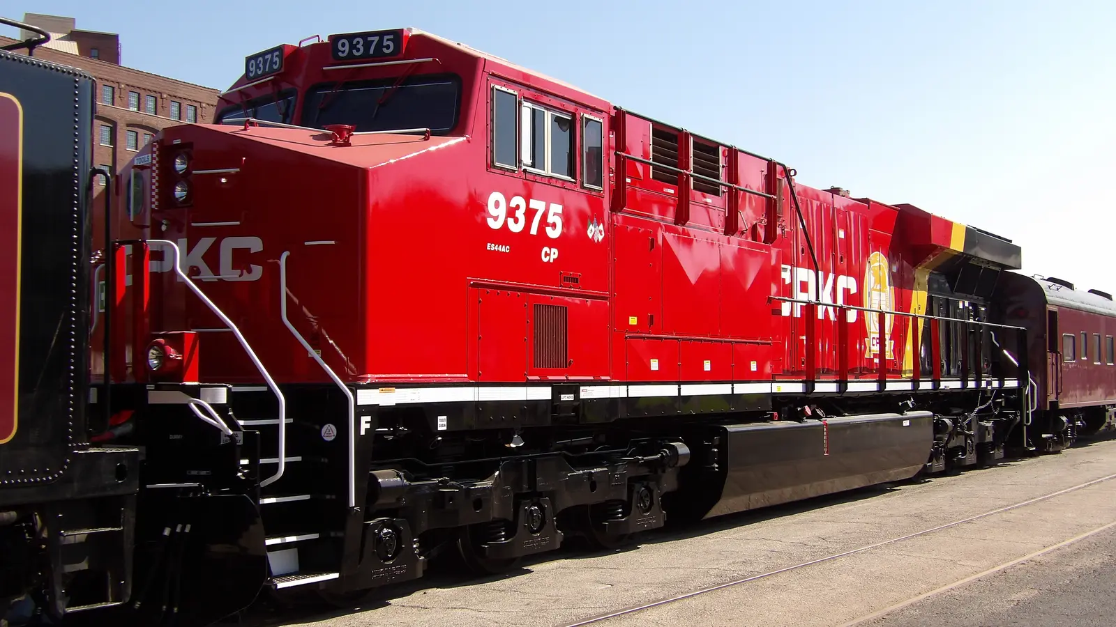 A CPKC ES44AC locomotive in red livery at Kansas City Union Station. A CPKC ES44AC locomotive in red livery at Kansas City Union Station.