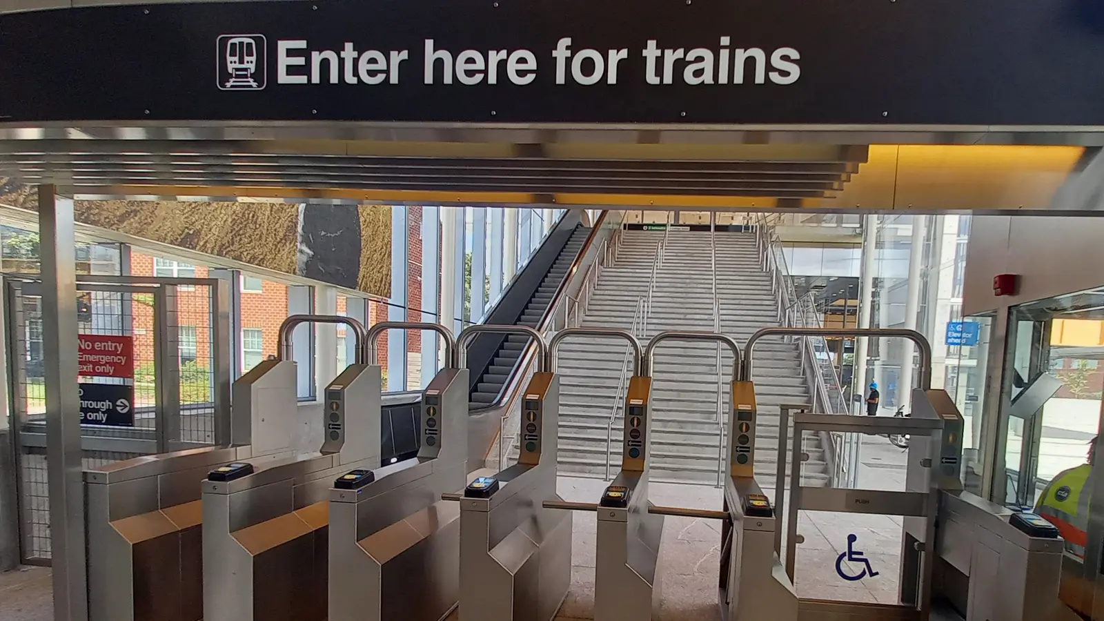 Existing CTA turnstiles and an accessible gate at Damen Green Line station in Chicago. Existing CTA turnstiles and an accessible gate at Damen Green Line station in Chicago.