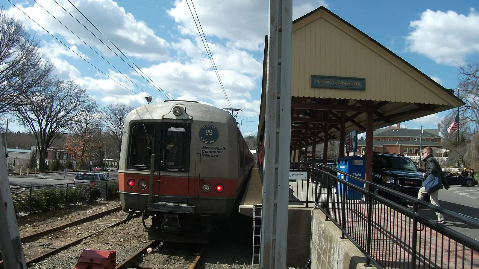 Metro-North M2 commuter train beside the New Canaan station platform in Connecticut Metro-North M2 commuter train beside the New Canaan station platform in Connecticut