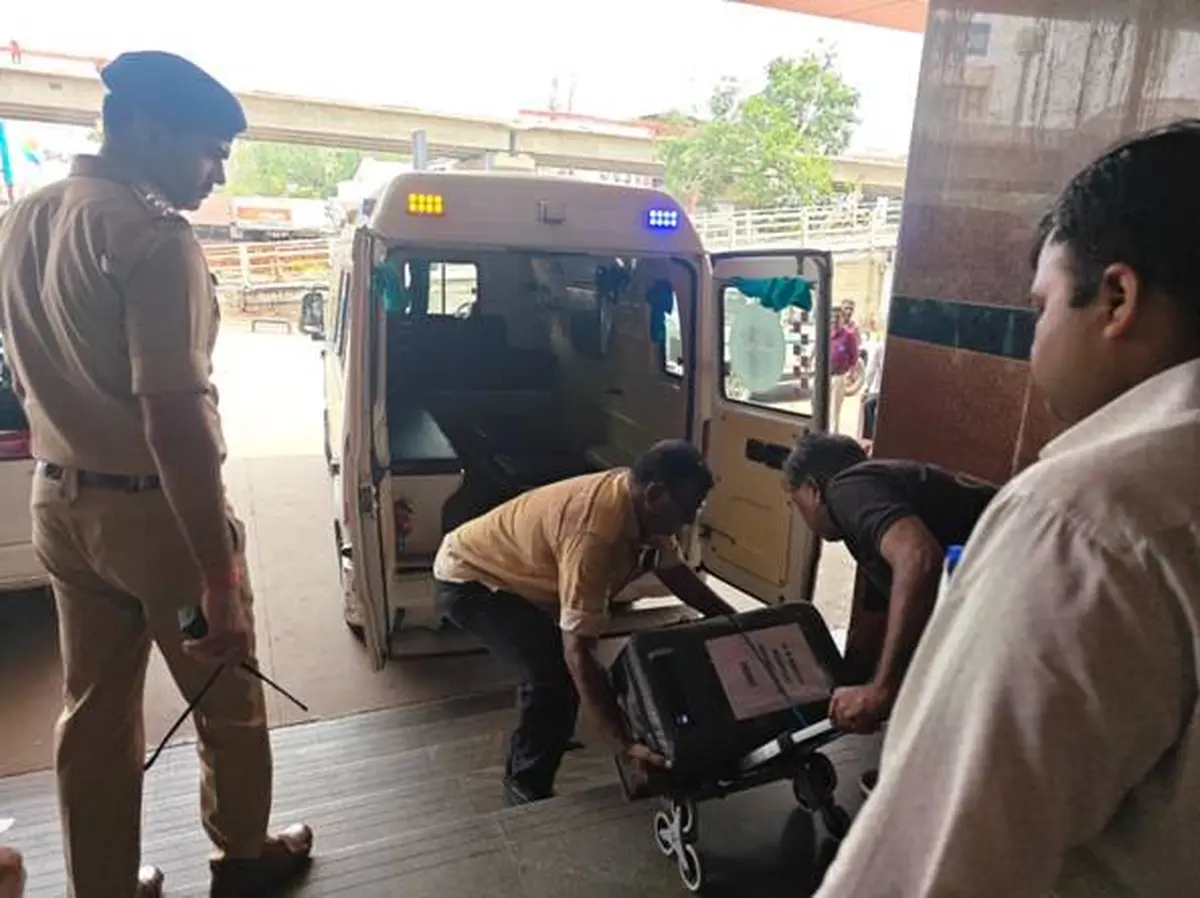 Police supervise the donor heart container as it is loaded into an ambulance at Ahmedabad Railway Station.