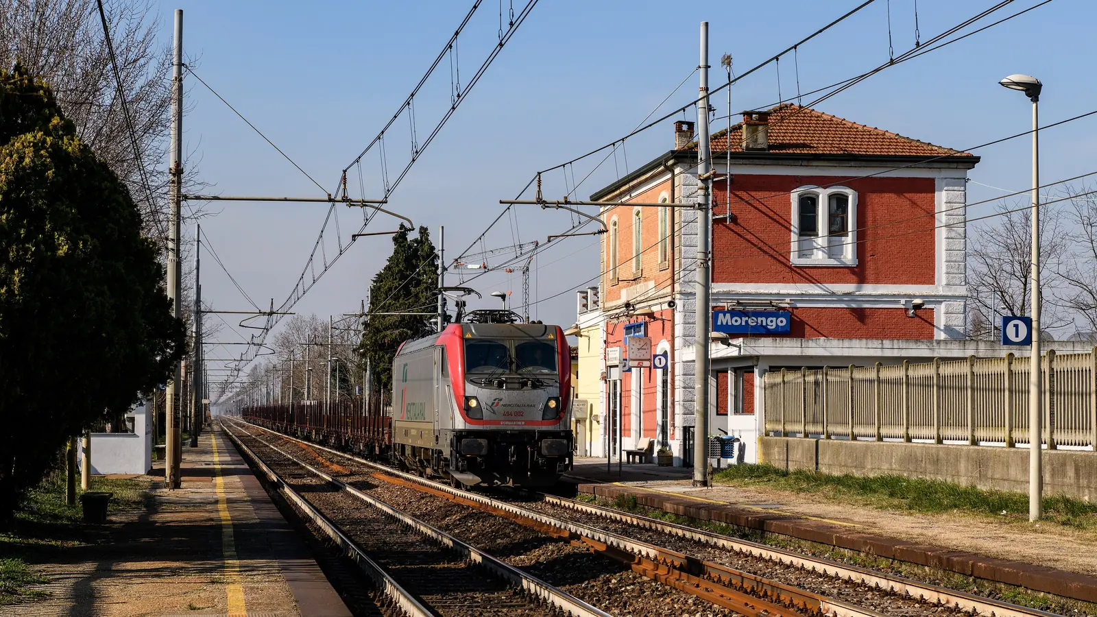 Mercitalia Rail freight train passing Morengo-Bariano station in northern Italy