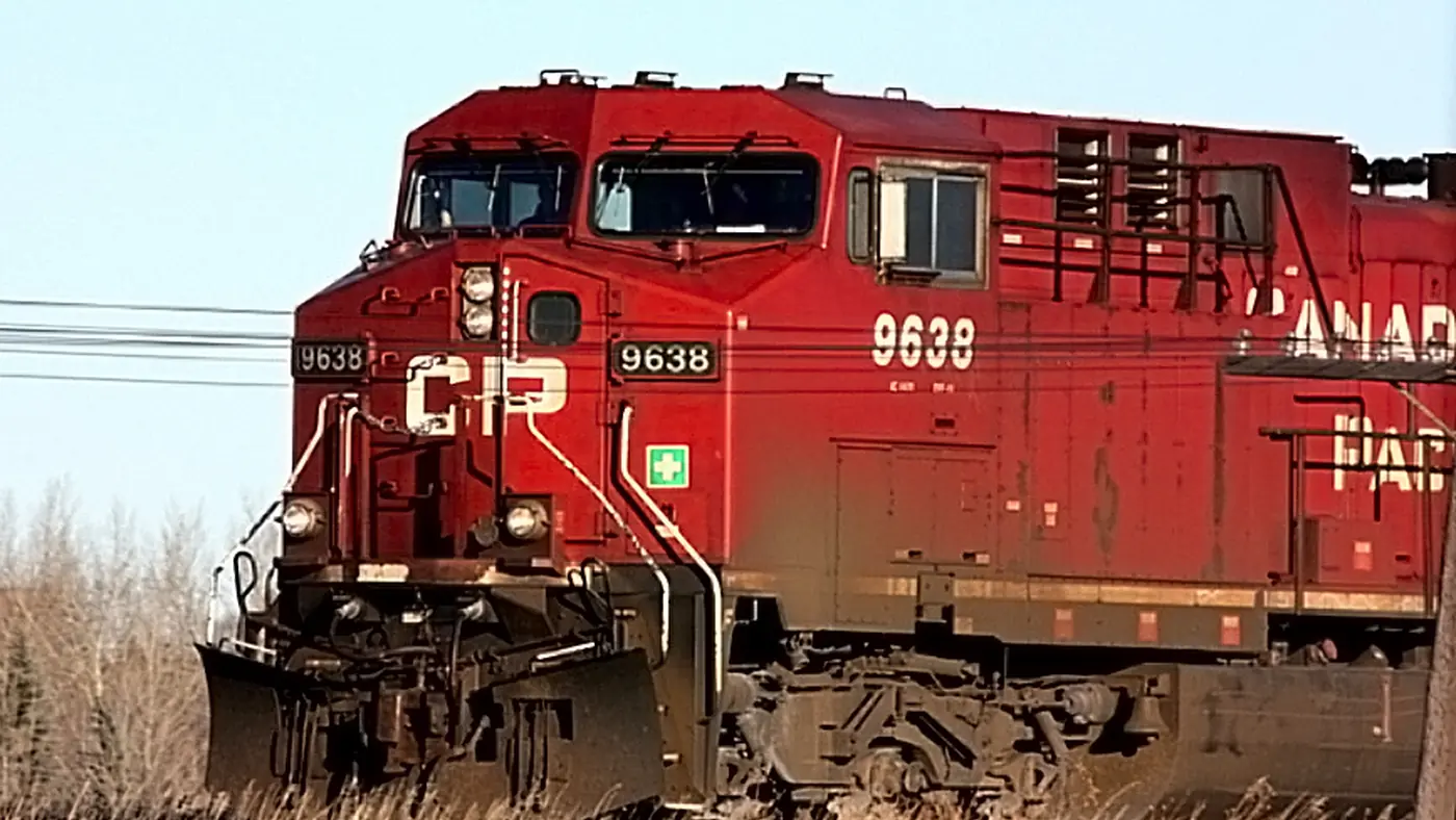 Archive photo of Canadian Pacific locomotive 9638 pulling freight cars near Regina, Saskatchewan