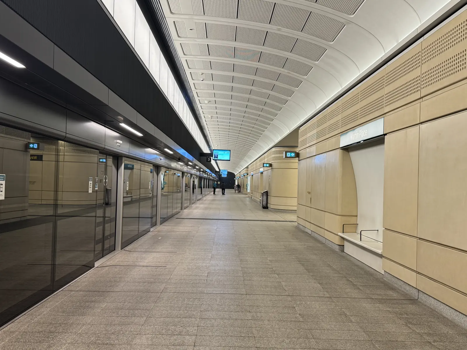 Sydney Metro platform with screen doors and an arched ceiling at Martin Place Station Sydney Metro platform with screen doors and an arched ceiling at Martin Place Station