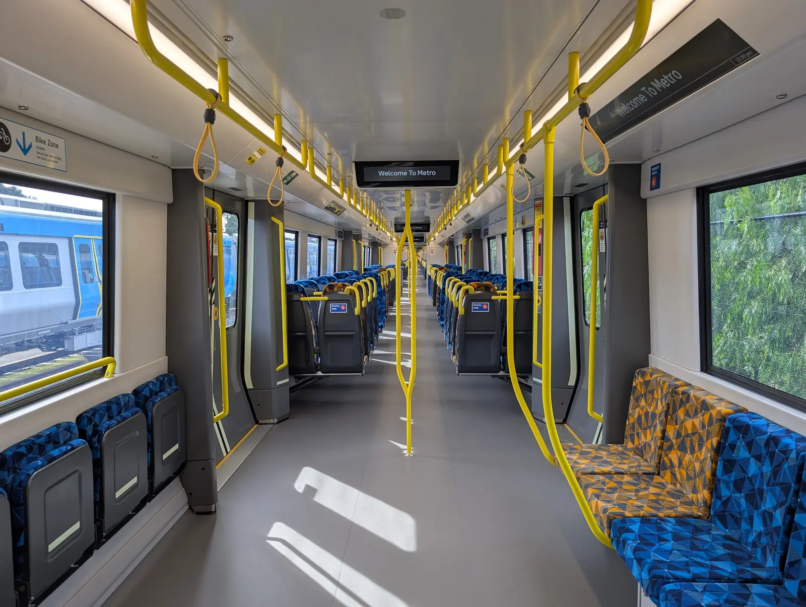X’trapolis 2.0 passenger interior Interior of an X’trapolis 2.0 train showing the continuous walkway, seating and handrails