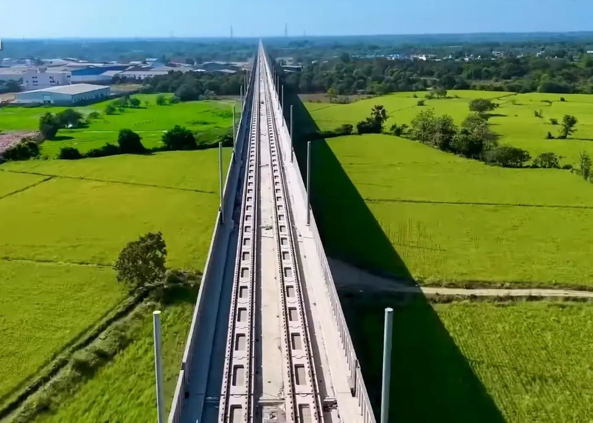 Elevated Mumbai–Ahmedabad high-speed rail track crossing green fields in India. Elevated Mumbai–Ahmedabad high-speed rail track crossing green fields in India.