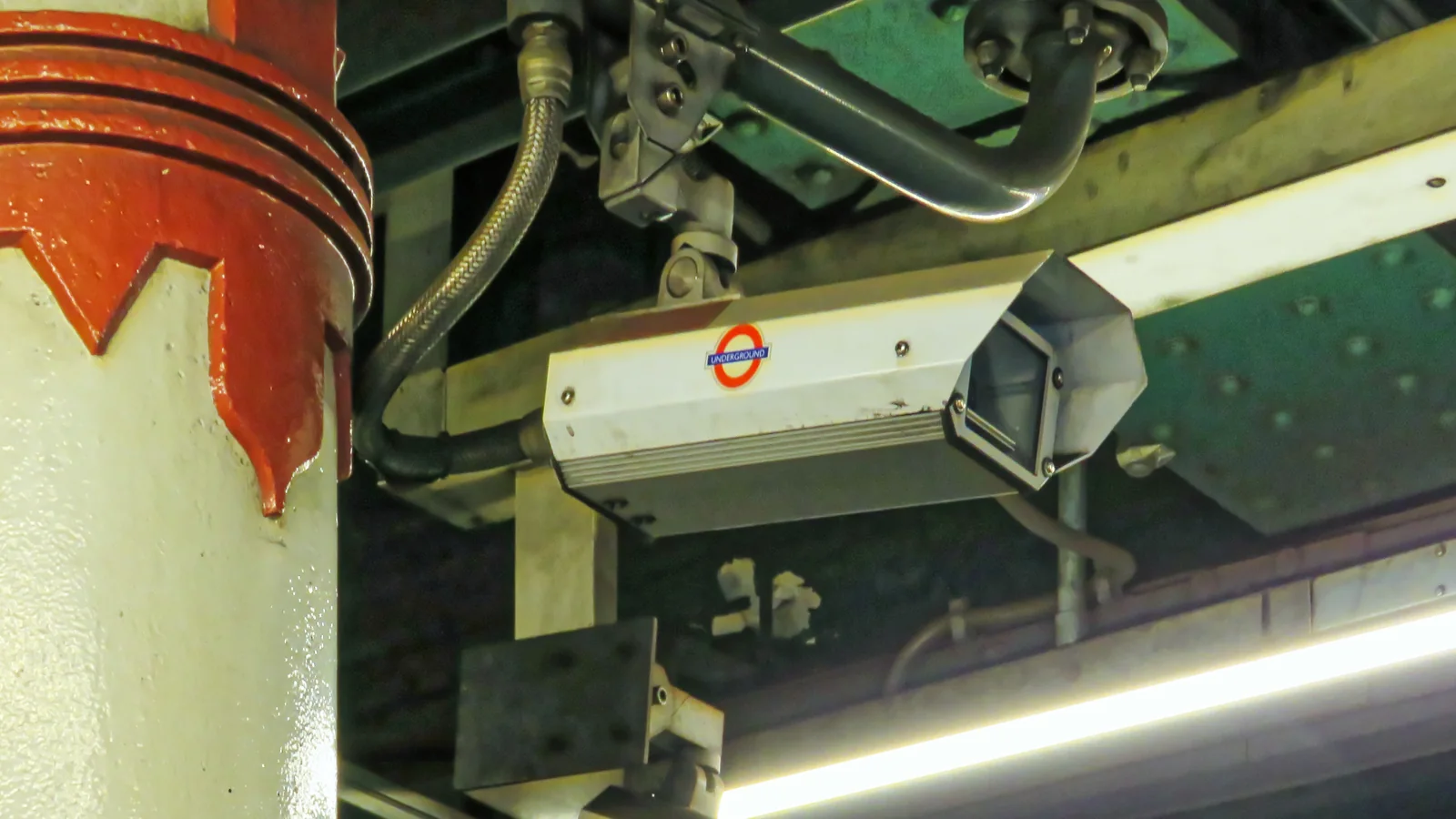 Security cameras mounted above a platform at Temple Underground station in London. Security cameras mounted above a platform at Temple Underground station in London.