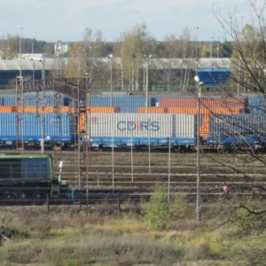 Freight tracks, containers and a PKP Cargo locomotive at Małaszewicze freight station in Poland