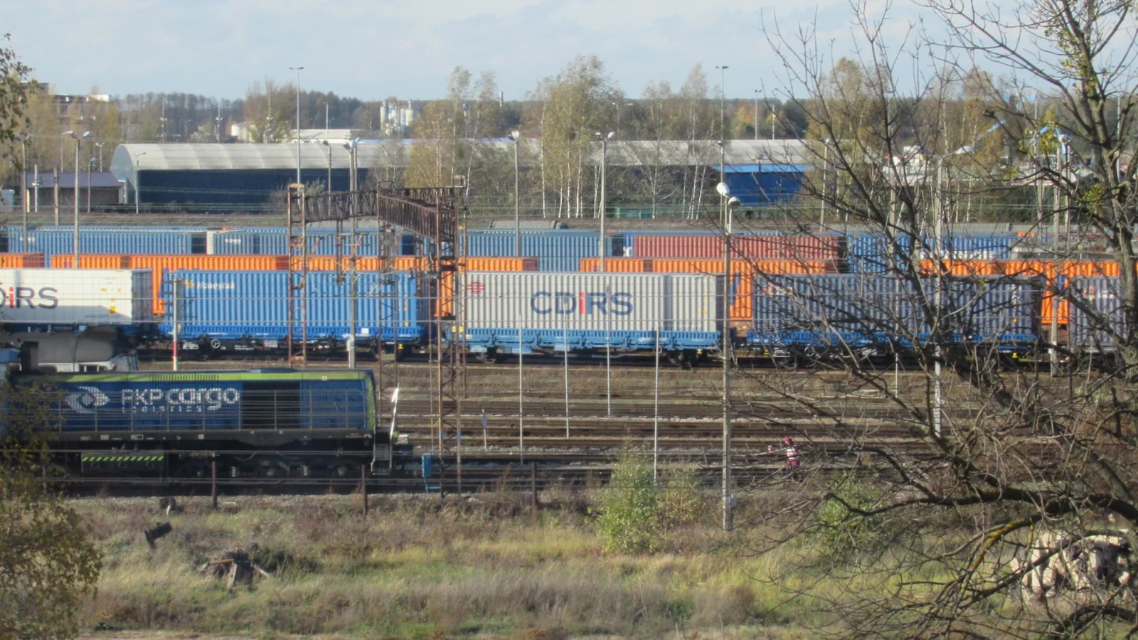 Freight tracks, containers and a PKP Cargo locomotive at Małaszewicze freight station in Poland Freight tracks, containers and a PKP Cargo locomotive at Małaszewicze freight station in Poland