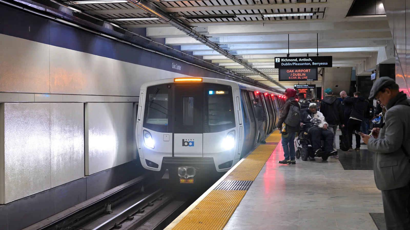 Passengers boarding a BART Blue Line train at Civic Center/UN Plaza station in San Francisco. Passengers boarding a BART Blue Line train at Civic Center/UN Plaza station in San Francisco.