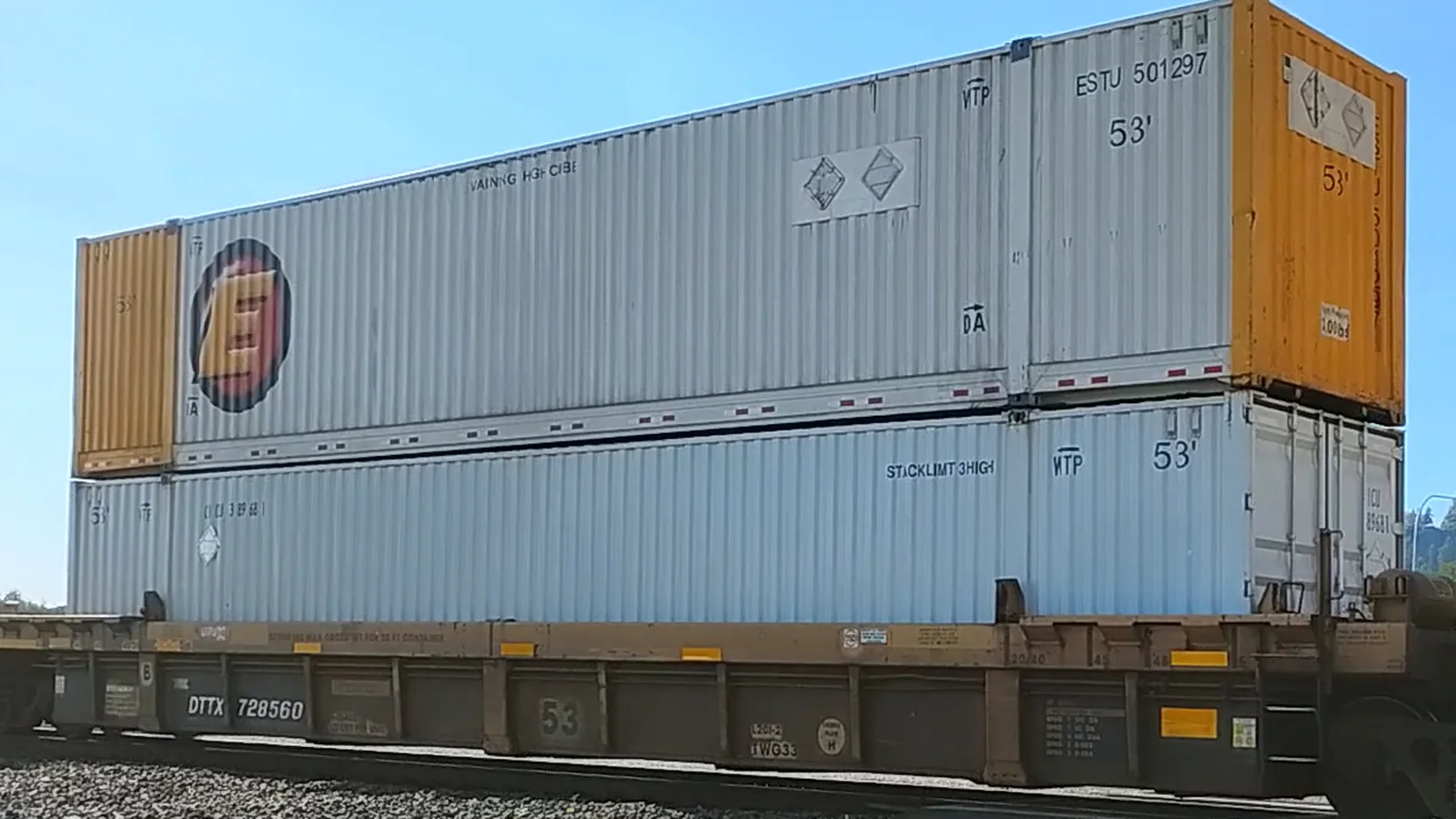 Double-stacked shipping containers on a well freight car in Spokane, Washington.