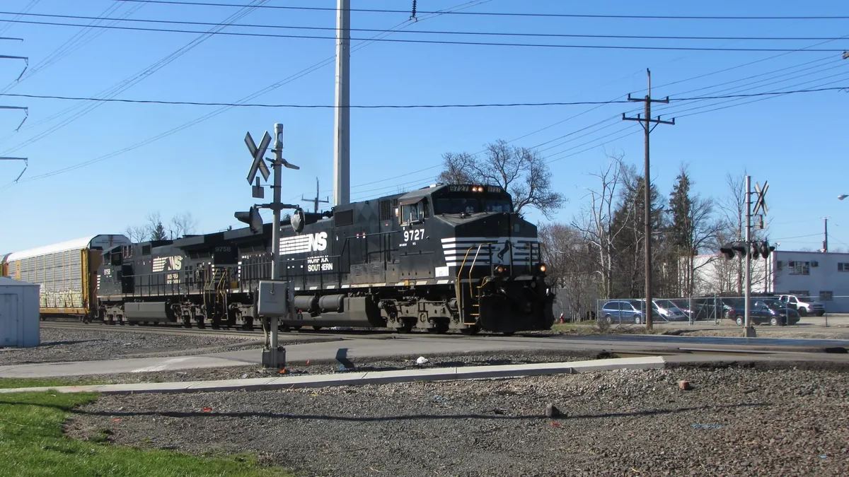 Norfolk Southern freight train passing a level crossing in Bedford, Ohio Norfolk Southern freight train passing a level crossing in Bedford, Ohio