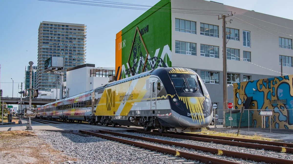 Brightline train passing a level crossing in Miami, Florida. Brightline train passing a level crossing in Miami, Florida.