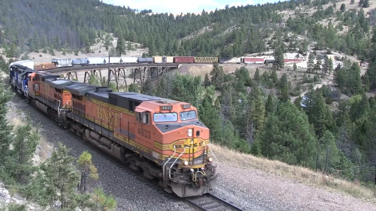BNSF and Montana Rail Link locomotives hauling a freight train through Mullan Pass. BNSF and Montana Rail Link locomotives hauling a freight train through Mullan Pass.