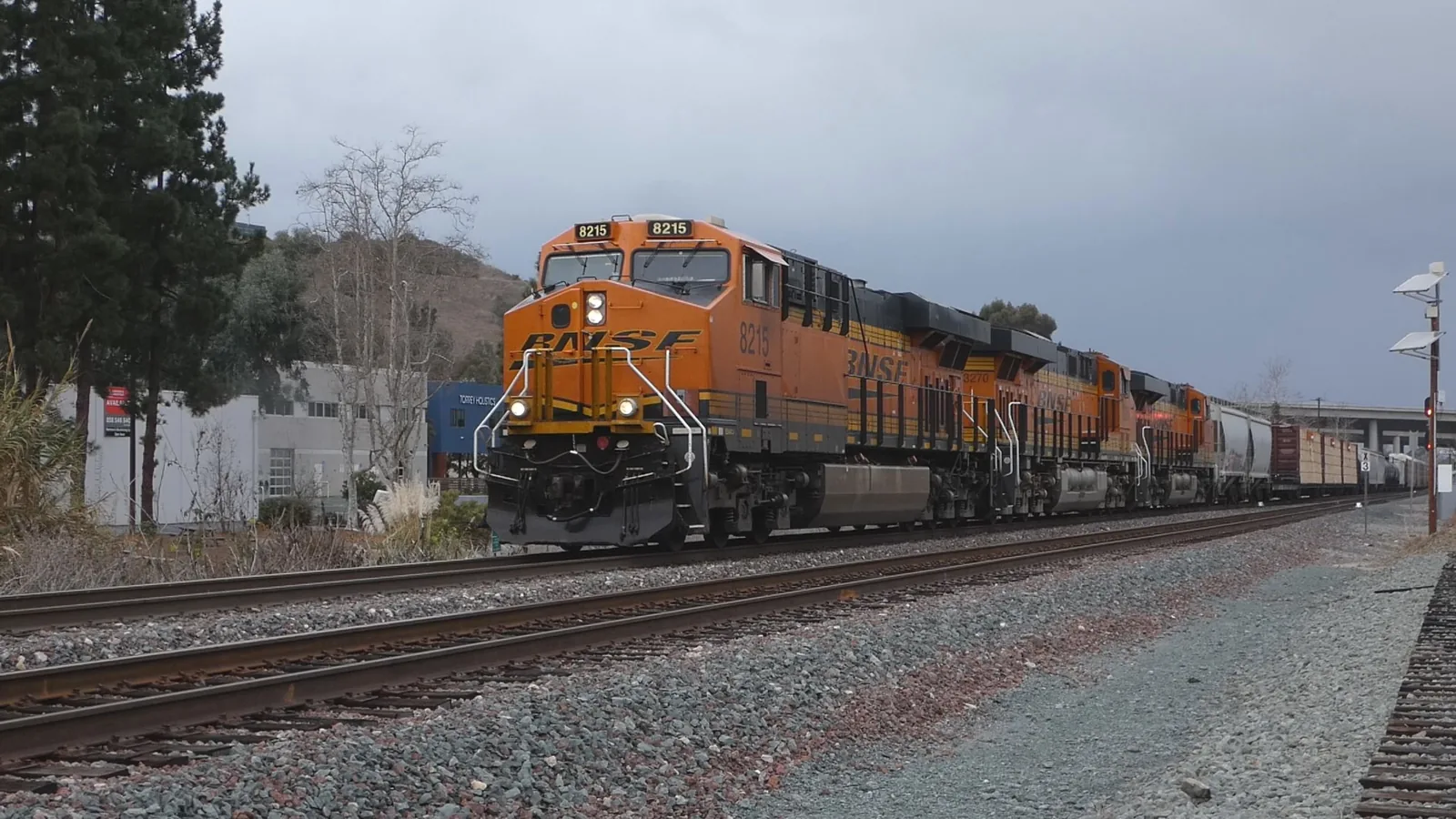 BNSF locomotive 8215 leading a freight train in San Diego, California