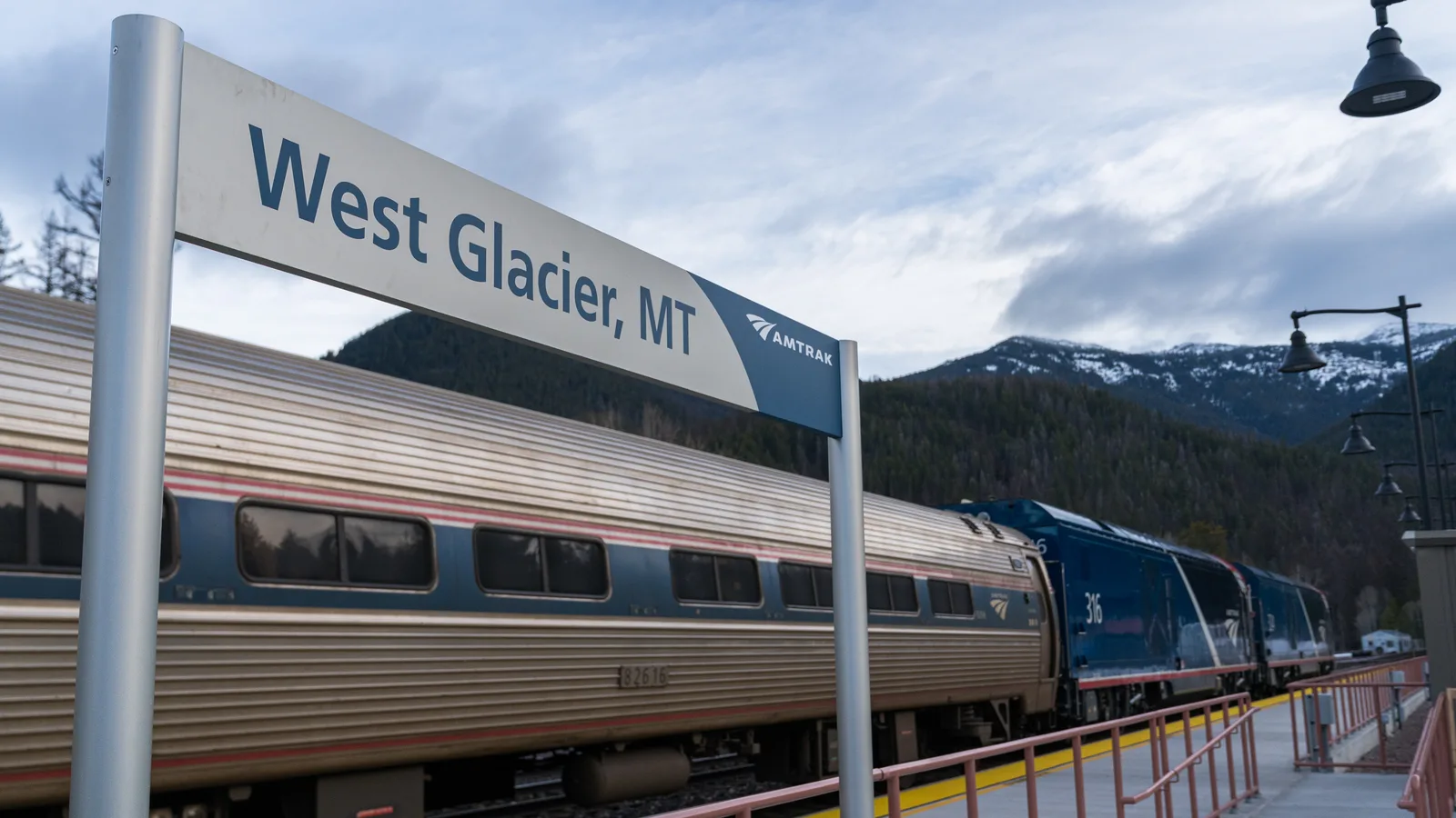 Amtrak Empire Builder stopped beside the West Glacier, Montana station sign
