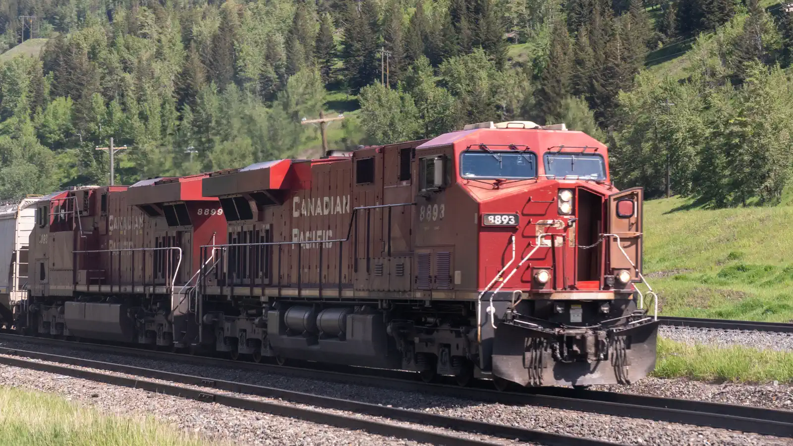 Canadian Pacific locomotives hauling a freight train through Crowsnest Pass in British Columbia
