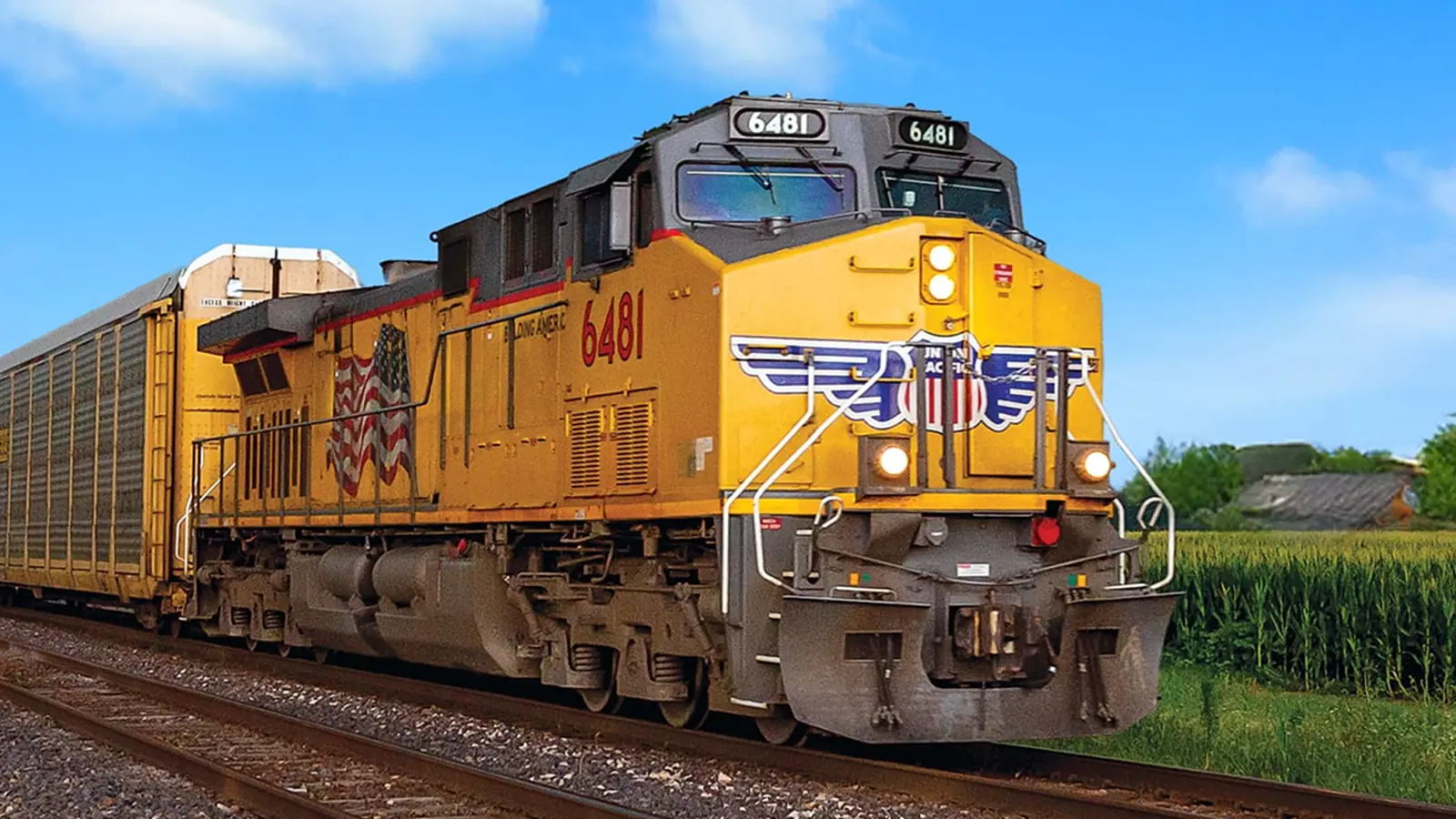 A Union Pacific freight locomotive hauling autorack cars
