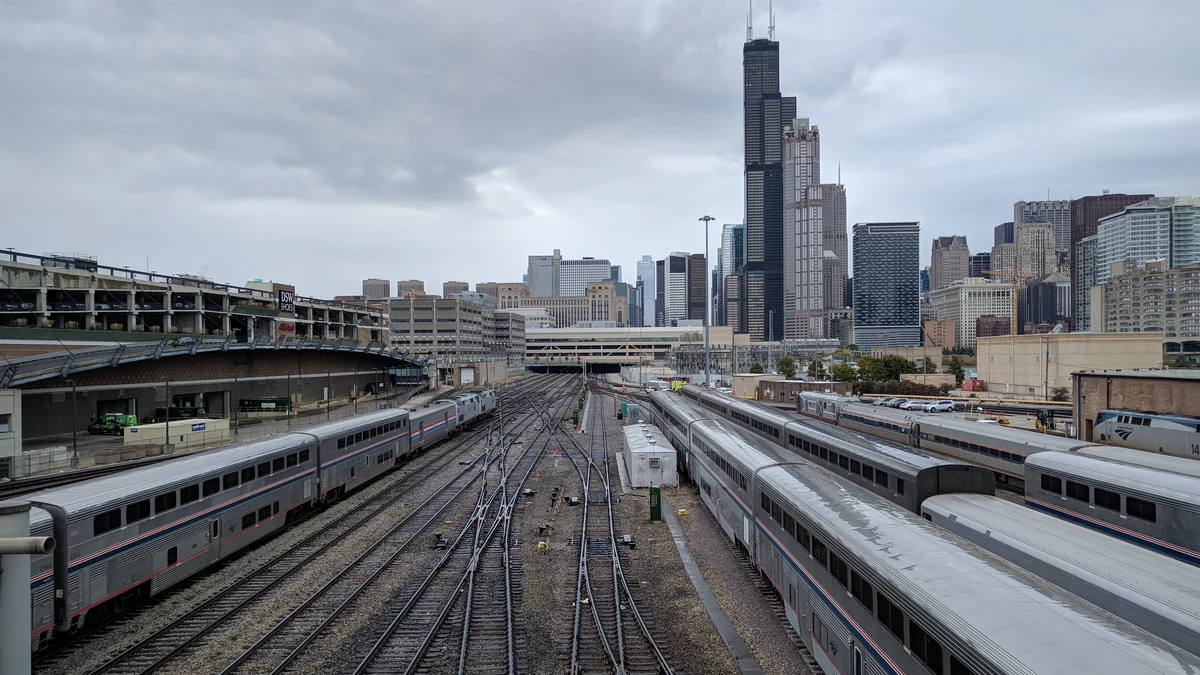     Amtrak’s 14th Street Coach Yard in Chicago’s South Loop, with the city skyline in the background