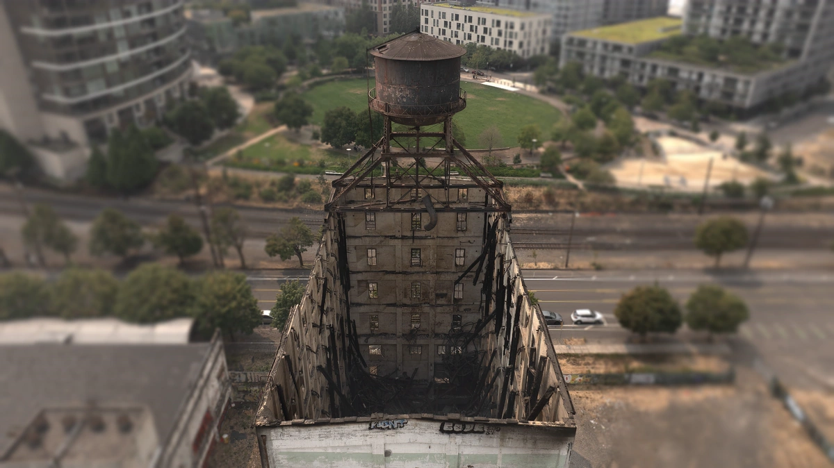 The fire-damaged Centennial Mills warehouse in Portland, Oregon, adjacent to Union Pacific tracks