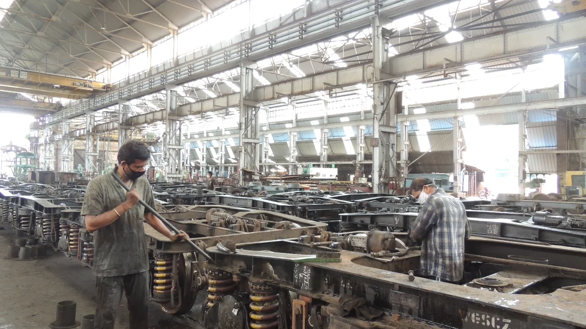 Freight wagon bogies inside an Indian Railways workshop
