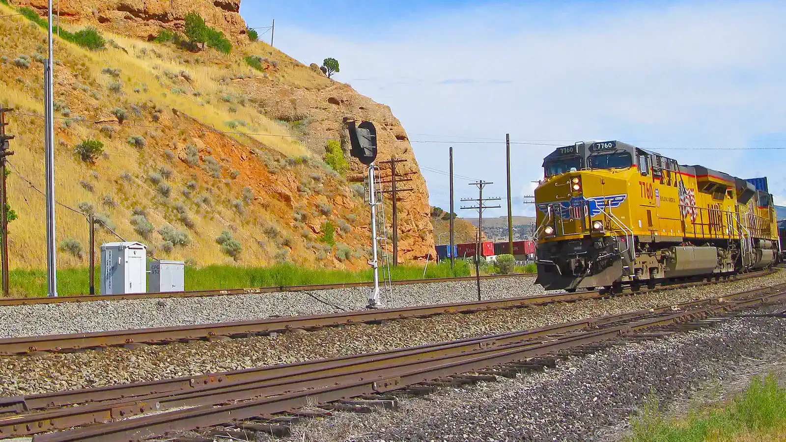 Union Pacific freight train passing PTC trackside equipment in Echo, Utah