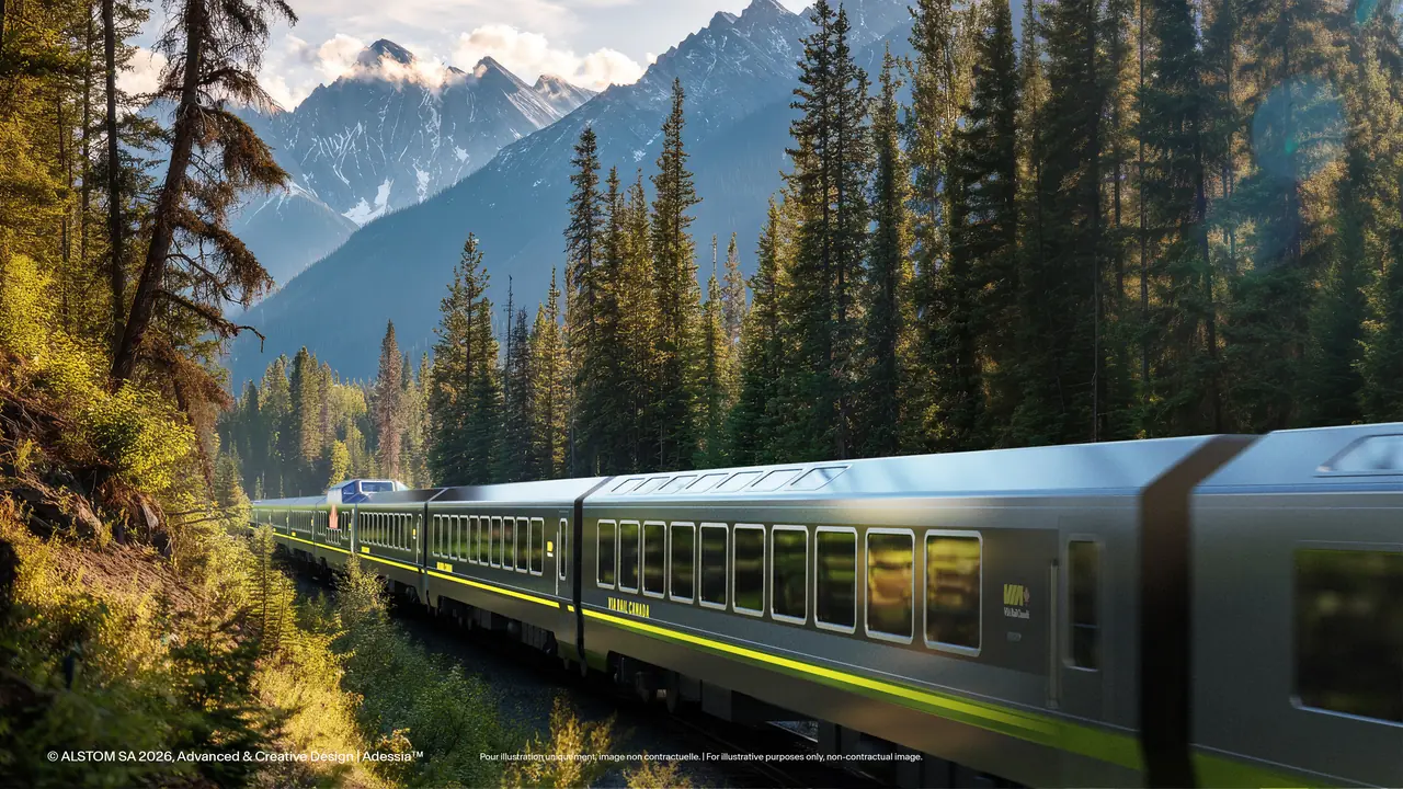 Official rendering of VIA Rail Adessia passenger cars in a forested mountain landscape
